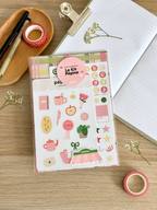 Contenu du Kit Pépine présenté à plat : planches, fonds papier et sticker à l'unité