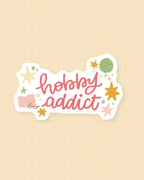 Sticker Hobby Addict : citation pour les loisirs créatifs, 5,5 × 2,5 cm, finition brillante