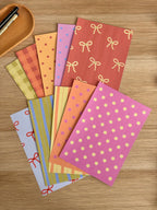 Fonds de scrapbooking Pépine photographiés en pile, format A5