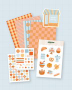 Kit de scrapbooking La boulangerie : les trois planches de stickers, les quatre fonds papier et le sticker boulangerie