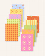 Pack n° 1 de fonds pour scrapbooking Pépine : les dix feuilles A5 imprimées, motifs et couleurs variés