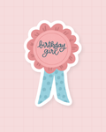 Sticker Birthday Girl : rosette d'anniversaire rose et bleue, finition brillante